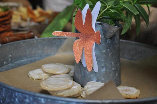 Lemon Verbena Thins Lemon Verbena Cookies on a tray with dragonfly decoration