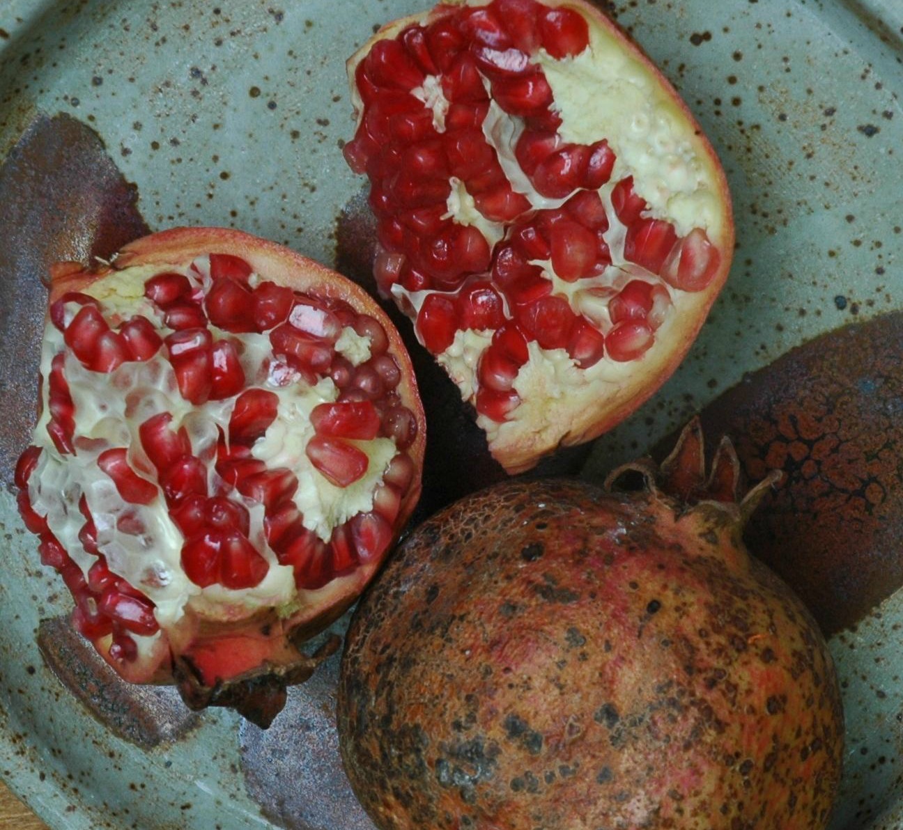 Pomegranate harvested from our tree, pottery by Lisa's daughter