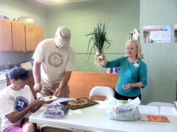 Above: Dallas County Master Gardeners-Cindy, Tim, and Linda with our onions harvested in 2013